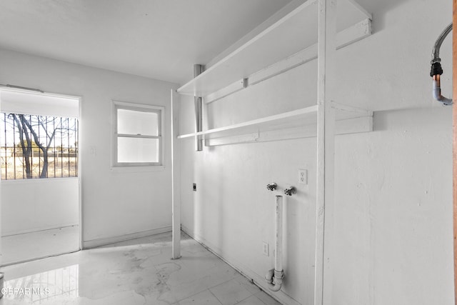 laundry room featuring laundry area, washer hookup, and marble finish floor