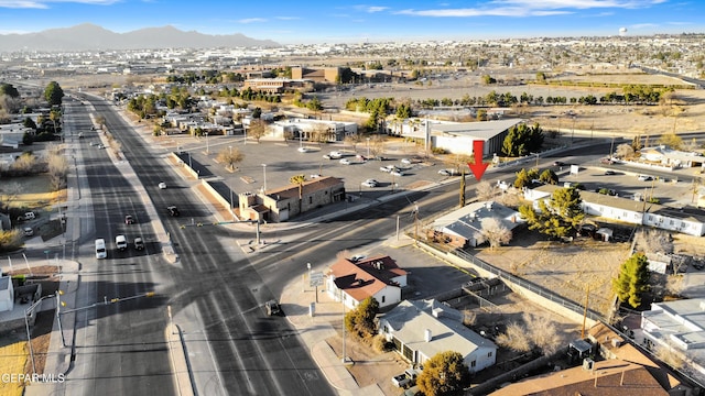 drone / aerial view with a residential view and a mountain view