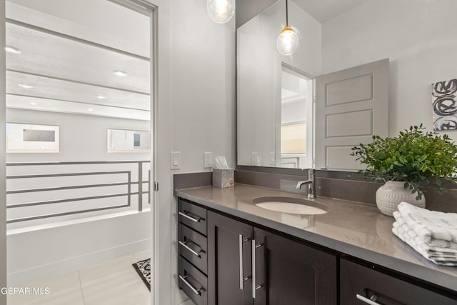 bathroom with tile patterned floors, recessed lighting, and vanity