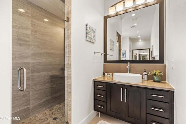 bathroom featuring recessed lighting, a shower stall, visible vents, and vanity