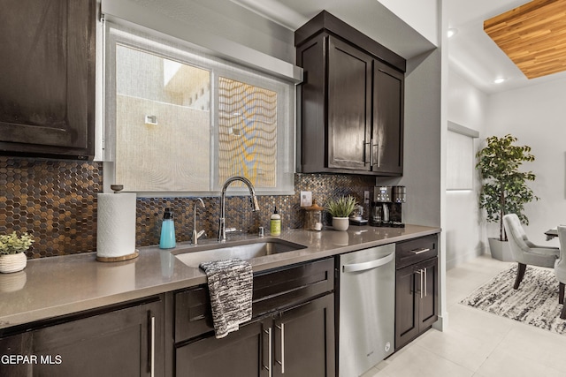 kitchen with dishwasher, dark brown cabinets, tasteful backsplash, and a sink