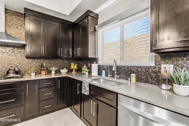 kitchen with wall chimney exhaust hood, appliances with stainless steel finishes, light countertops, and dark brown cabinetry