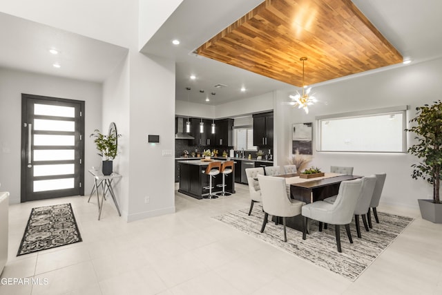 dining space featuring baseboards, wooden ceiling, and recessed lighting