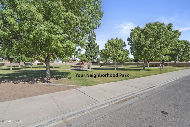 view of community with playground community and a lawn