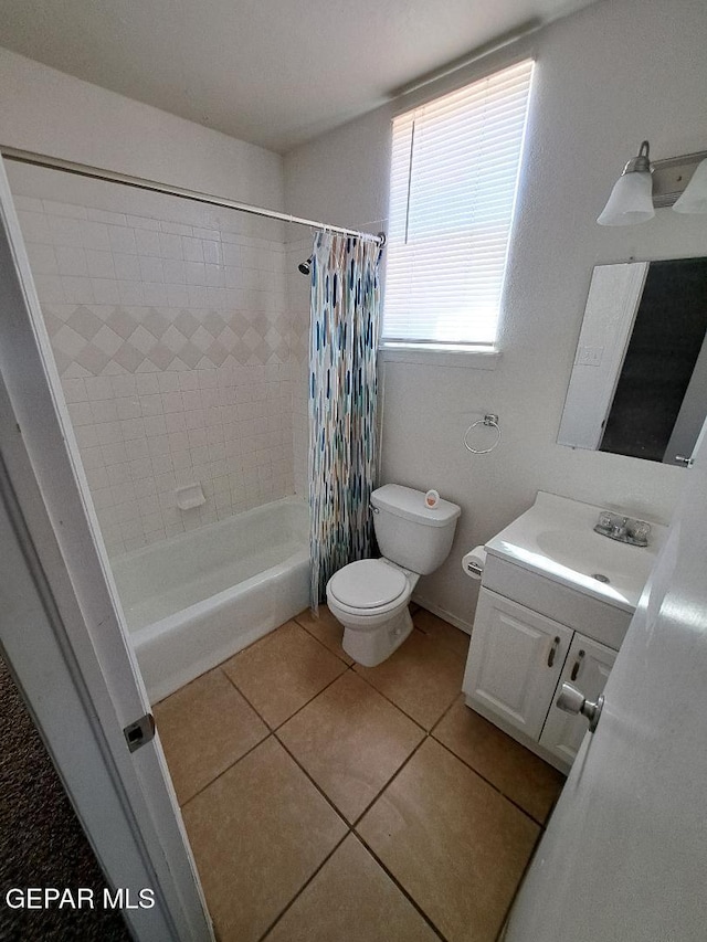 bathroom featuring toilet, tile patterned flooring, shower / bath combination with curtain, and vanity