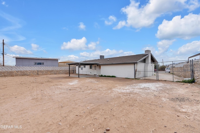 rear view of property with a patio area and fence