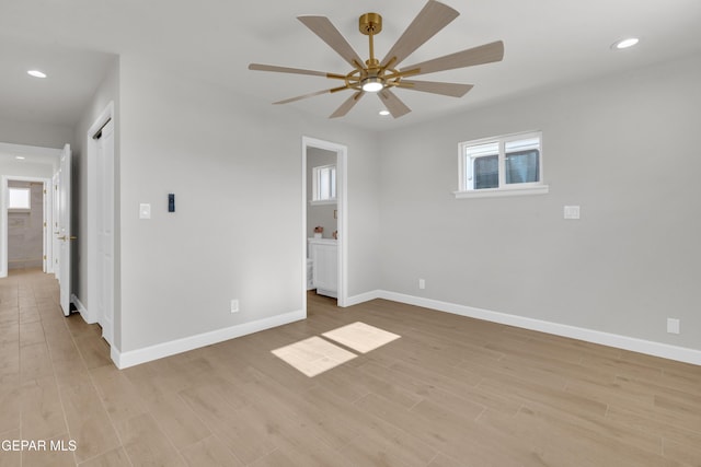 empty room with baseboards, ceiling fan, recessed lighting, and light wood-style floors