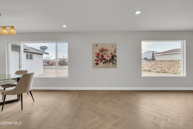 dining room with recessed lighting and baseboards