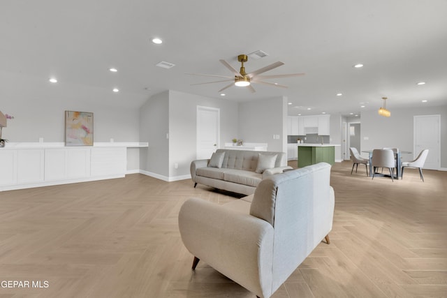 living room featuring recessed lighting, visible vents, ceiling fan, and baseboards