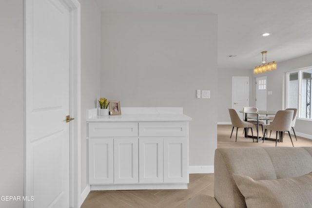 dining room featuring recessed lighting and baseboards