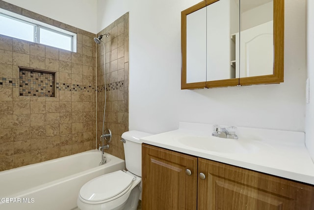 bathroom with toilet, vanity, and shower / tub combination