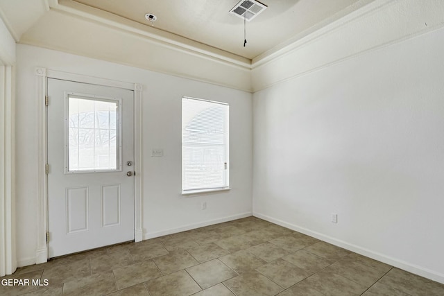 entrance foyer featuring baseboards and visible vents