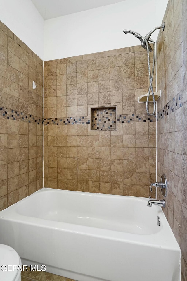 full bathroom with shower / bath combination and toilet