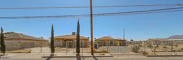 view of yard with a fenced front yard and a gate