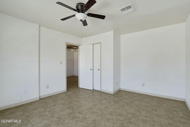 unfurnished bedroom featuring baseboards, visible vents, and a ceiling fan