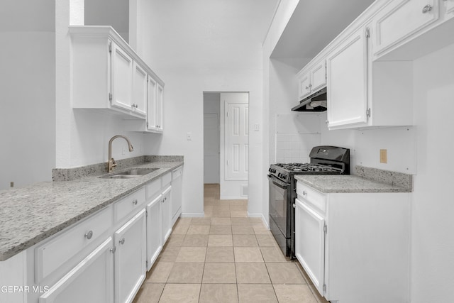 kitchen with white cabinets, a sink, under cabinet range hood, and black range with gas stovetop