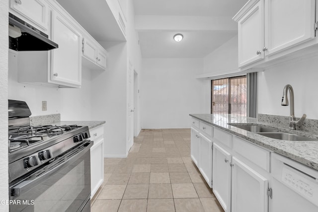 kitchen featuring black gas range oven, light stone countertops, under cabinet range hood, white cabinetry, and a sink