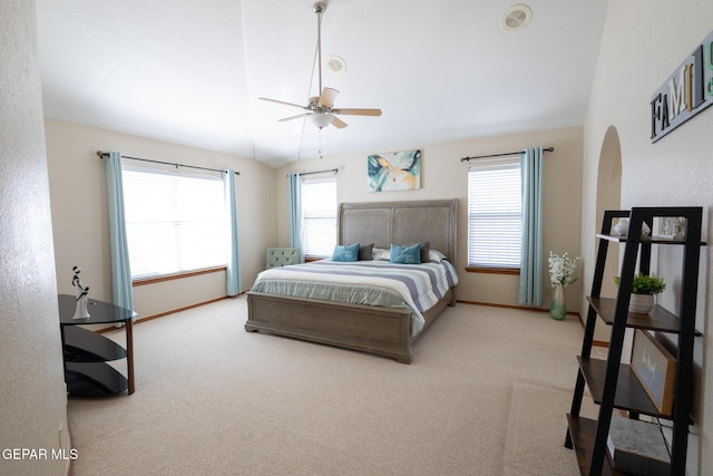 carpeted bedroom featuring lofted ceiling, a ceiling fan, and baseboards