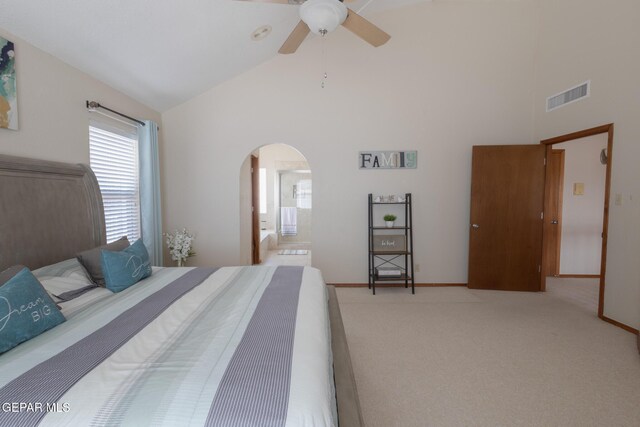 carpeted bedroom with high vaulted ceiling, arched walkways, visible vents, and ceiling fan