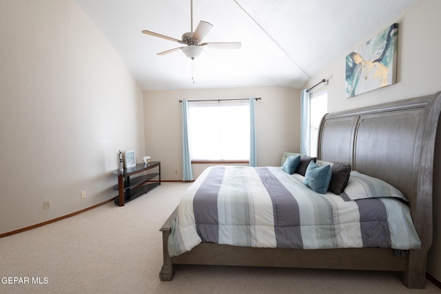 carpeted bedroom featuring lofted ceiling, ceiling fan, and baseboards