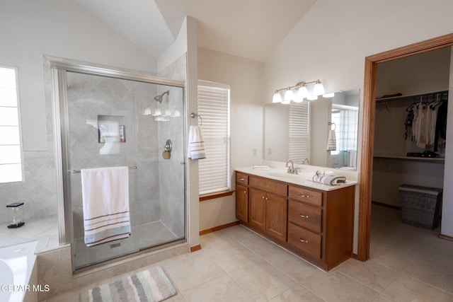 full bath featuring tile patterned floors, a garden tub, vaulted ceiling, vanity, and a shower stall