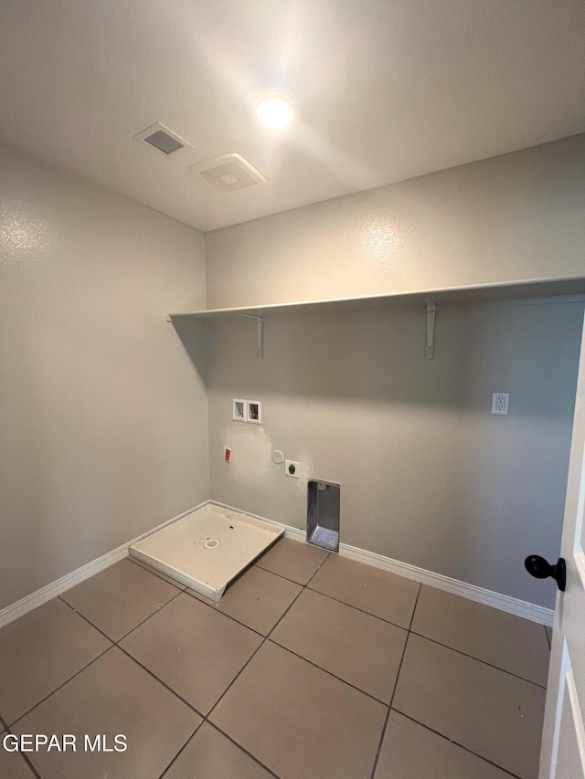 laundry room featuring gas dryer hookup, hookup for a washing machine, laundry area, visible vents, and tile patterned floors