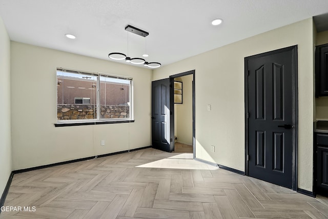 interior space with recessed lighting and baseboards