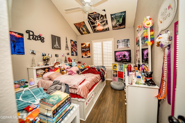 bedroom featuring lofted ceiling, dark wood-style floors, baseboards, and a ceiling fan