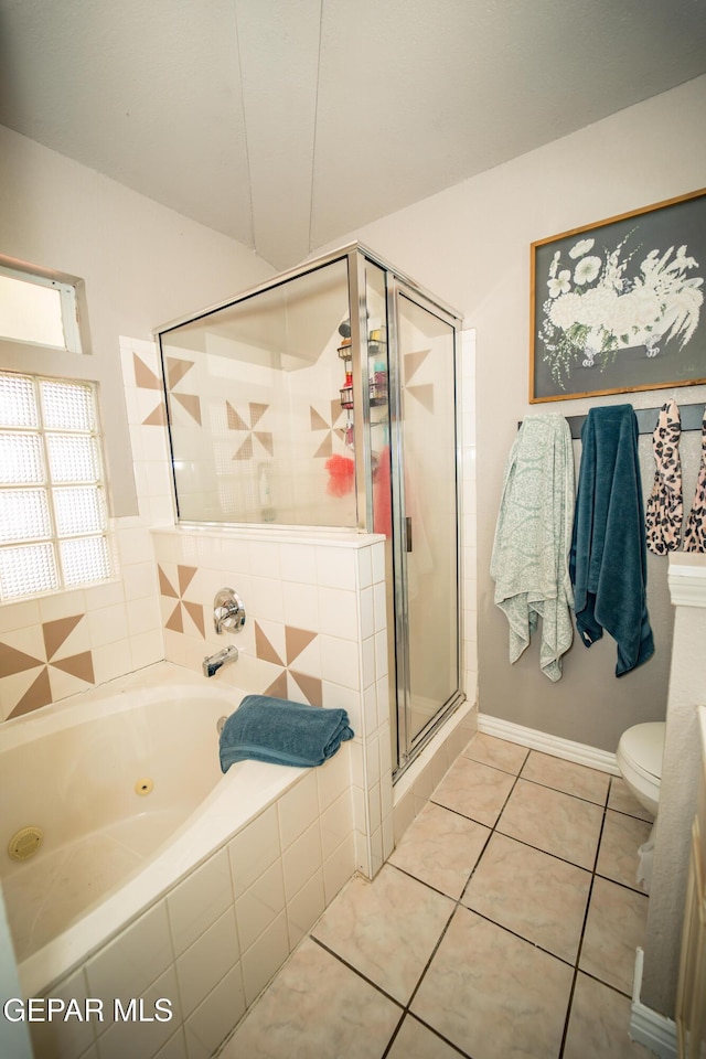 bathroom featuring a stall shower, tile patterned flooring, toilet, and a tub with jets