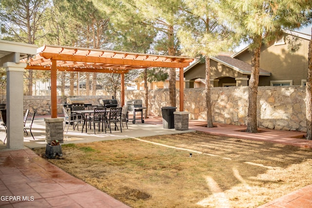 exterior space with a patio area, fence, and a pergola