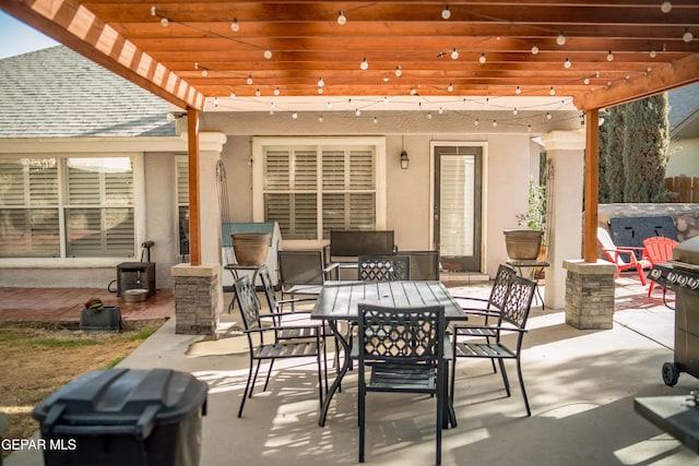 view of patio with outdoor dining area and a pergola