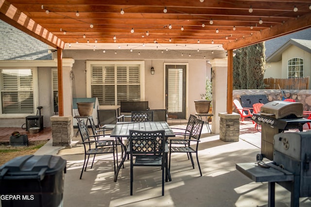 view of patio / terrace featuring outdoor dining area, a jacuzzi, grilling area, and a pergola