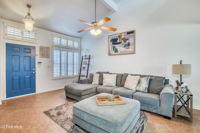 living room featuring baseboards, a ceiling fan, and tile patterned floors