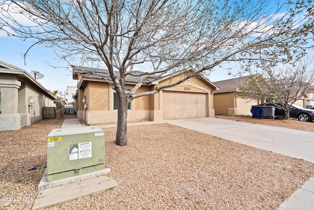 ranch-style home featuring driveway, an attached garage, and stucco siding