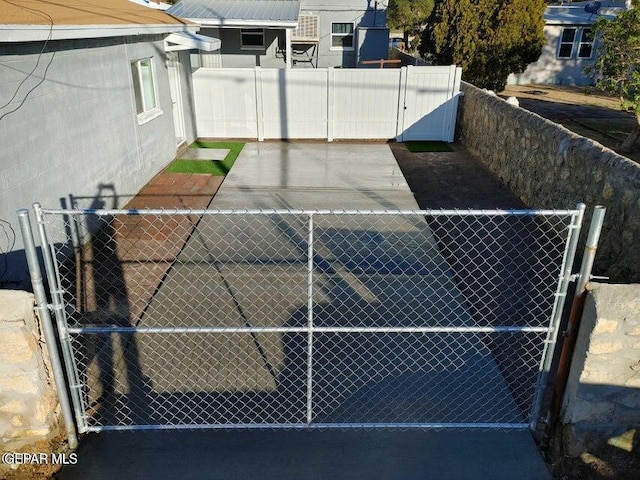 view of tennis court with fence