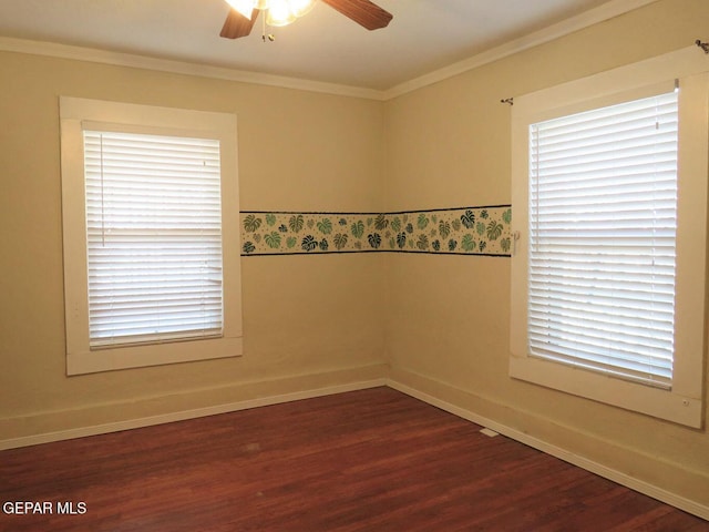 spare room with a ceiling fan, baseboards, ornamental molding, and dark wood-style flooring