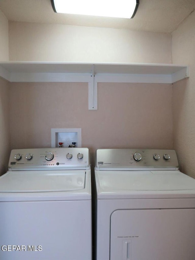 washroom with laundry area and washing machine and clothes dryer