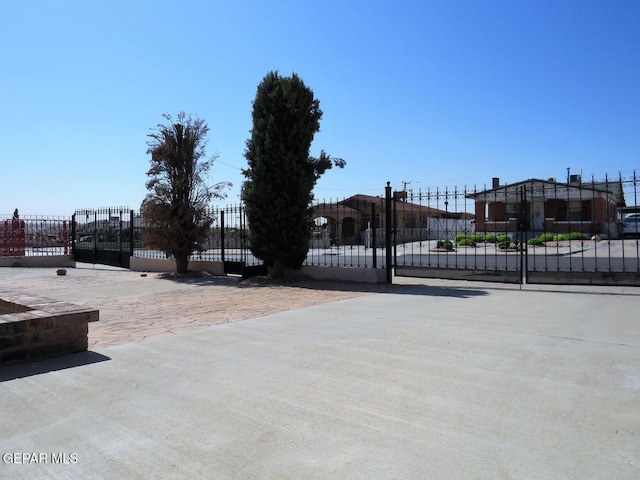 view of gate featuring fence