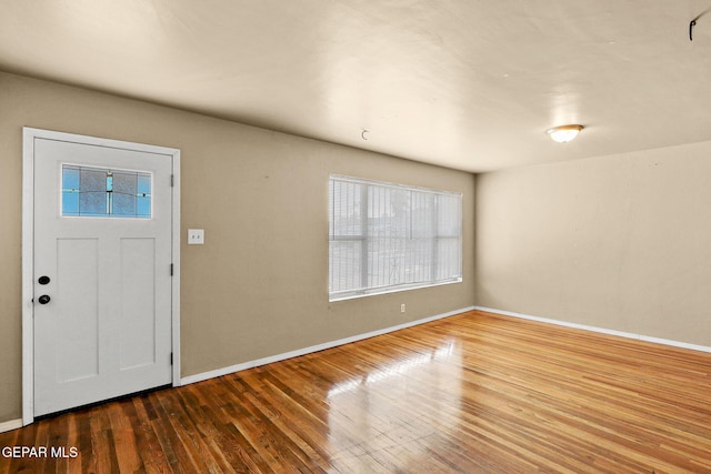 entrance foyer with wood finished floors and baseboards