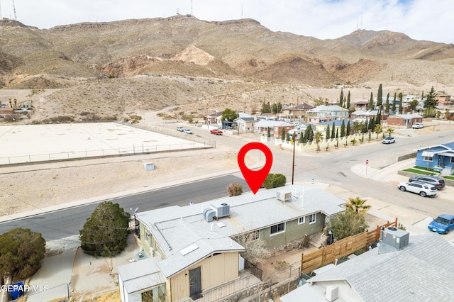 birds eye view of property with a residential view and a mountain view