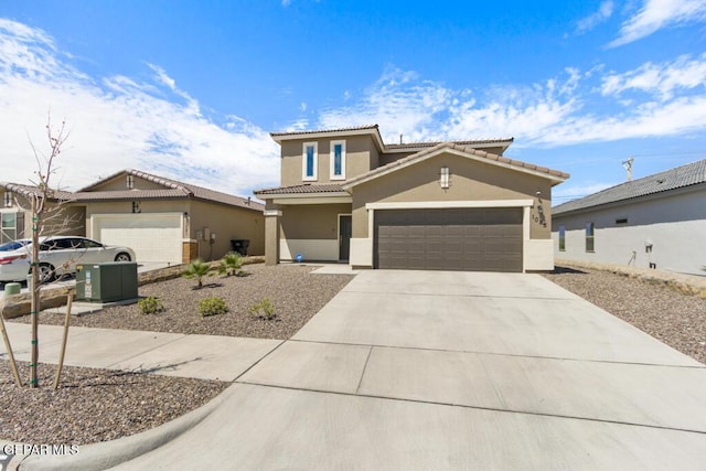 mediterranean / spanish home with a garage, driveway, a tile roof, and stucco siding