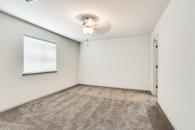 carpeted empty room with ceiling fan