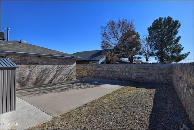 view of yard featuring a fenced backyard and a patio