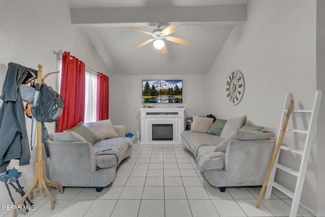 living area featuring vaulted ceiling with beams, light tile patterned flooring, a glass covered fireplace, and a ceiling fan