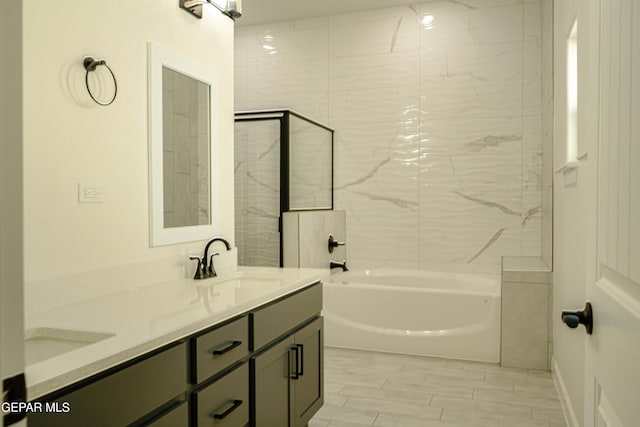 bathroom featuring double vanity and a sink