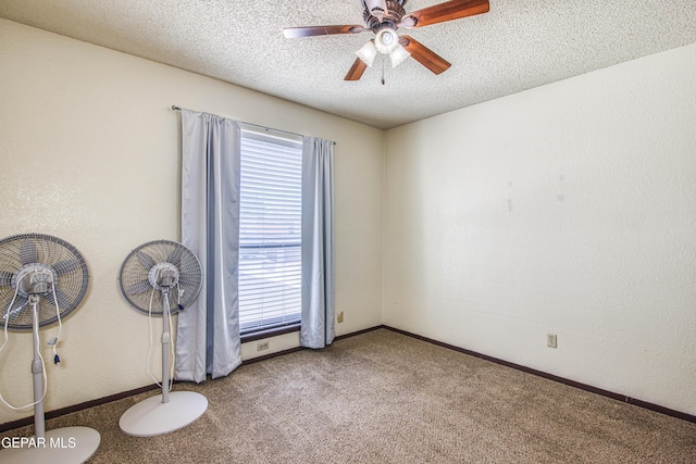 unfurnished room with carpet, ceiling fan, a textured ceiling, and baseboards