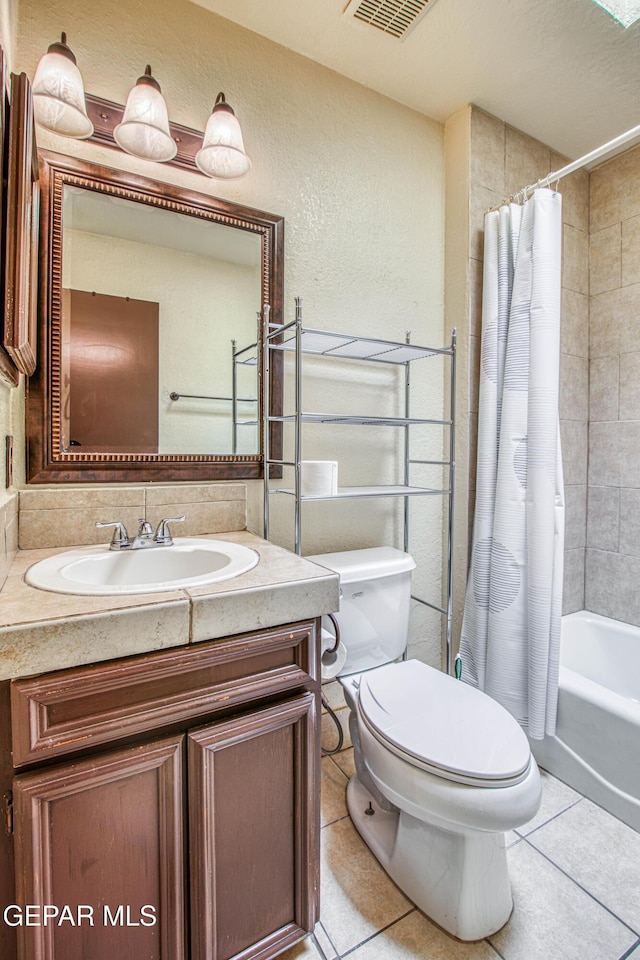 full bathroom with visible vents, toilet, shower / tub combo with curtain, tile patterned flooring, and vanity