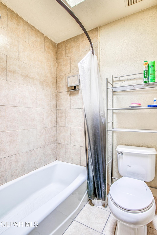 bathroom with shower / bath combo, visible vents, toilet, and tile patterned floors