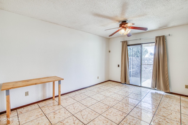 empty room with light tile patterned floors, a textured ceiling, baseboards, and a ceiling fan