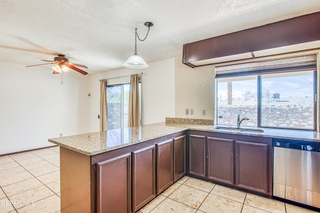 kitchen with a textured ceiling, a peninsula, a sink, dishwasher, and pendant lighting